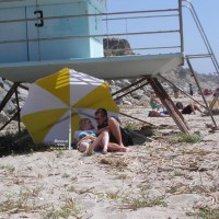 Couple On Public Beach