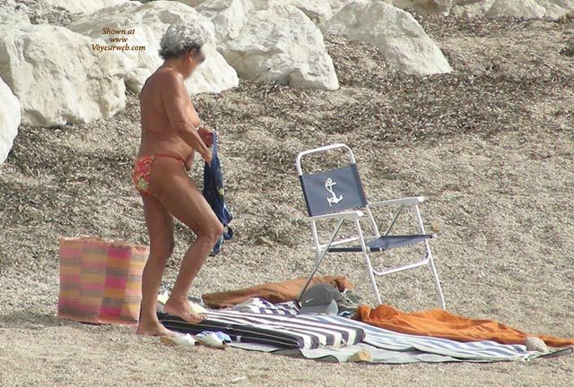 Pic #1 Old Woman Changing On The Beach