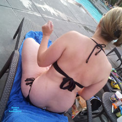 Busting out of rasta bikini at neighbors complex pool